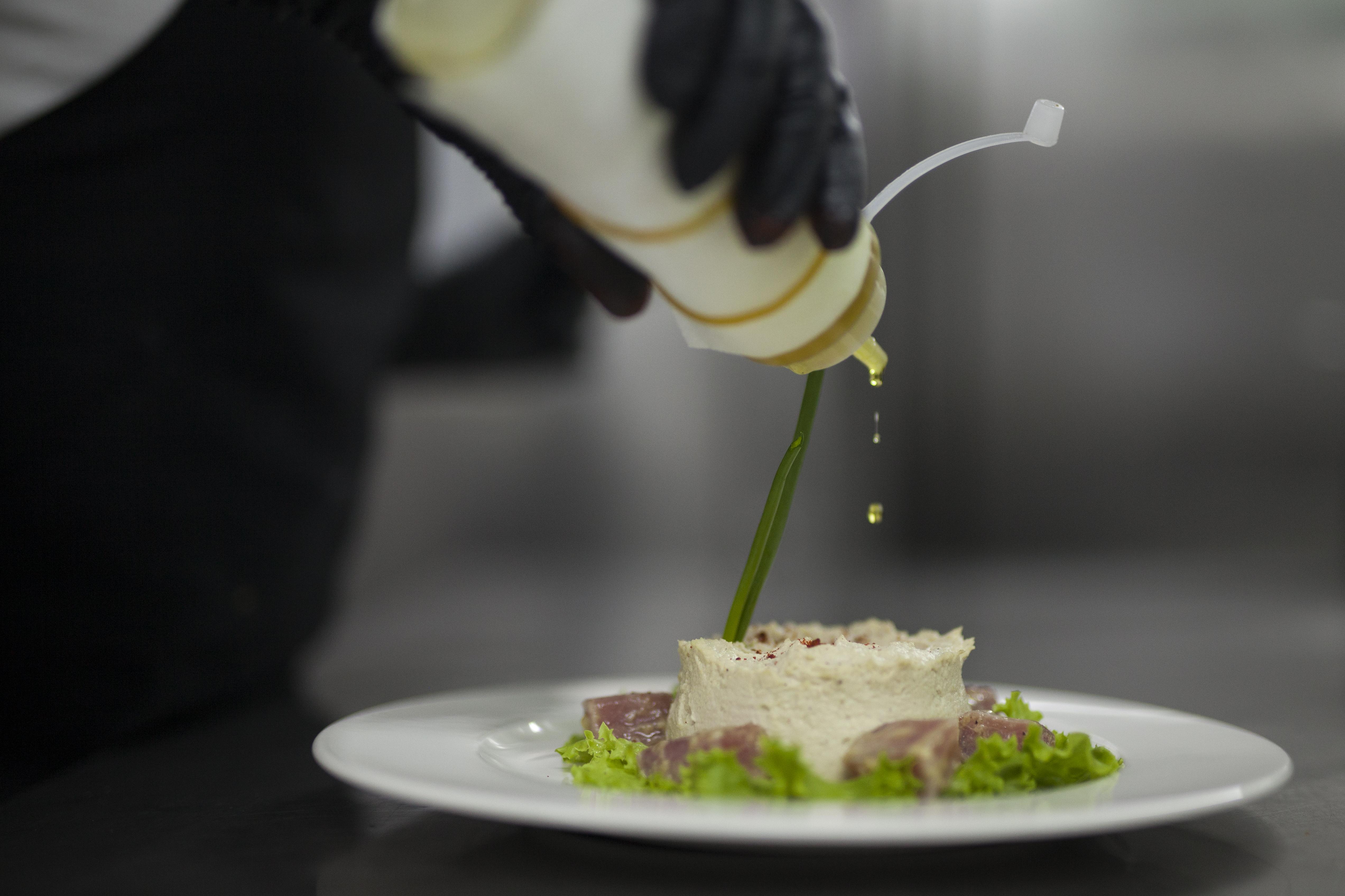 Grand Hotel Yerevan - Small Luxury Hotels Of The World Екстериор снимка A chef finishing a dish